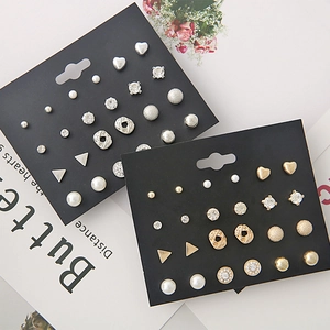 Detailed set of 12 pairs of gold and silver stud earrings with pearls and rhinestones