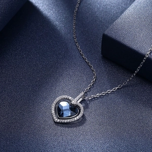 Elegant S925 sterling silver necklace with heart-shaped dark blue crystal and diamonds