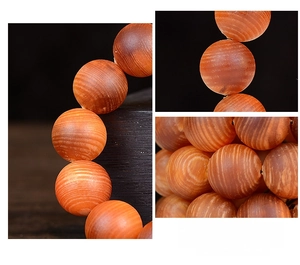 Macro detail of hand-polished natural wood grain on brown Buddhist prayer beads