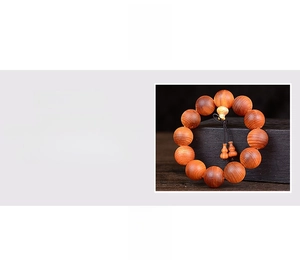Macro detail of translucent Blood Dragonwood prayer beads with gourd tassel pendant