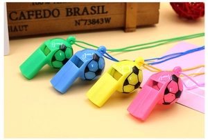 Detailed view of colorful soccer-shaped plastic whistles with matching lanyards