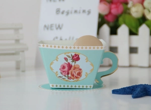 Detailed view of light blue gift box with pink rose pattern and gold European foil accents