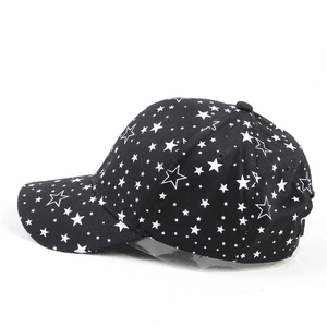 Black cotton baseball cap with white star prints from a stylish side-back view angle