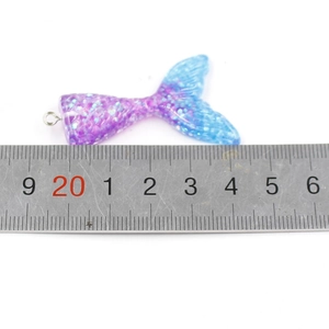 Macro shot of 3.8cm purple blue gradient mermaid tail pendant with scale texture