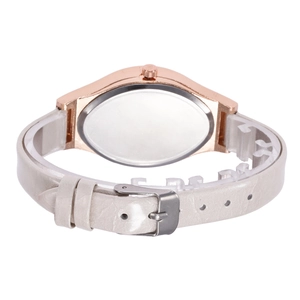 Detail of rose gold case with stainless steel back and pearly white leather strap buckle