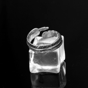 Macro shot of punk feather texture on adjustable stainless steel vintage silver ring