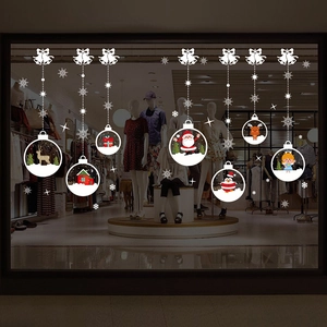 White Christmas window stickers featuring Santa, reindeer and snowflakes on glass