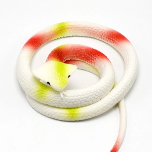 Close-up of realistic TPR rubber snake toy with green and red scales in a coiled pose