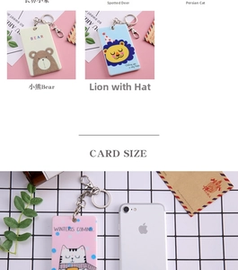 Detail of cartoon PVC card holders showing bear and lion patterns with metal keychains