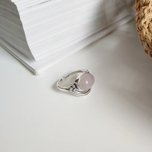 Detail of S925 sterling silver stamp and adjustable band with rose quartz stone