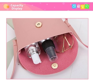 Pink dog-themed crossbody bag with magnetic flap showing interior storage capacity