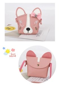 Detail showing the magnetic closure and cute puppy embroidery on a pink crossbody bag