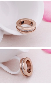 Macro shot of rose gold titanium ring with crystals and inner magnetic dots