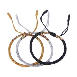 Handmade woven knot bracelets set of four in gold silver black and colorful cords