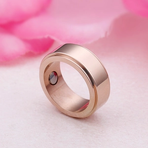 Polished rose gold titanium steel ring with internal magnet in a 45-degree angle view