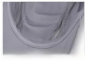 Detailed macro view of the breathable mesh lining and fine stitching on the outdoor cap