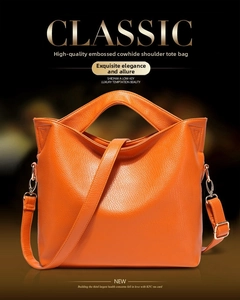Detailed macro view of orange lychee textured cowhide leather and metal hardware