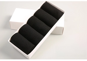 Five pairs of black bamboo fiber business socks neatly arranged in a white gift box