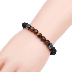 Men's 8mm tiger eye and volcanic lava stone beaded bracelet on a male wrist