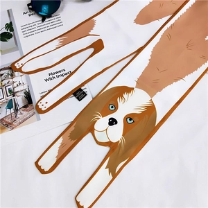 Detail of cartoon dog print long silk scarf for women made of 100% polyester fabric