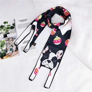 Detail of polyester scarf featuring cartoon French bulldog and pink egg prints