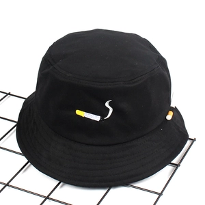 Street style black cotton bucket hat with cigarette embroidery and creative pendant detail