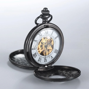 Detail of vintage hollow mechanical pocket watch with Roman numerals and golden gear movement