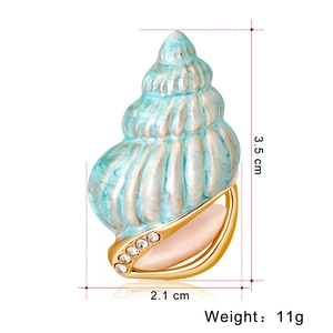Blue conch shell brooch pin with gold finish and sparkling crystal accents