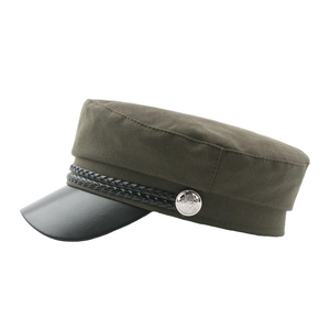 Olive green military sailor cap with black leather brim and decorative rope buttons