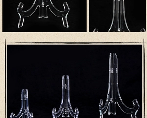 Three transparent acrylic plate display stands in different sizes on black background