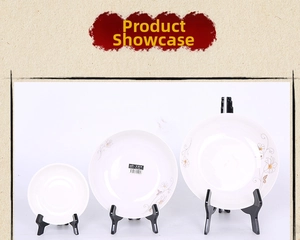 Three-piece set of white ceramic plates with floral patterns and black display stands