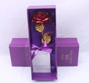 Detail of a red gold foil rose in a purple gift box with a Love 24K certificate
