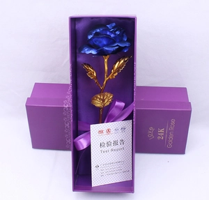 Detail of a 24K blue gold foil rose presented in a luxury purple velvet gift box