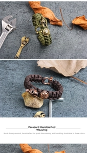 Detail of paracord survival bracelet with Spartan helmet and shield metal charms