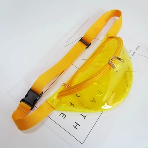 Close-up of vibrant yellow transparent PVC waist bag with gold zippers