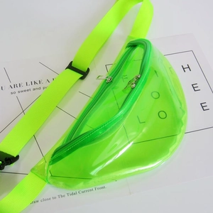 Macro detail of a neon green transparent PVC fanny pack showing zip and strap texture