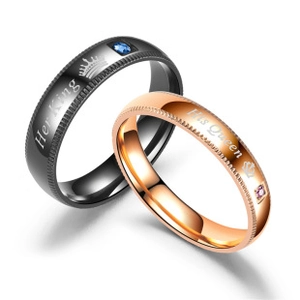 Detail of Her King and His Queen engraved titanium rings with small inlaid diamonds