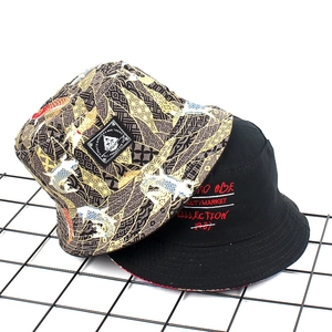 Detail of reversible bucket hat featuring Japanese koi print and gothic letter embroidery