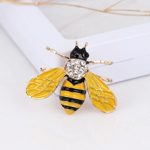 Macro shot of bee brooch with yellow enamel detail and sparkling crystal rhinestones