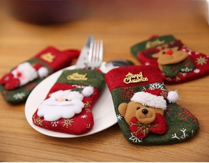 Detailed view of Christmas cutlery holders featuring Santa, Reindeer and Bear appliques