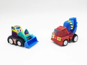 Macro detail of cartoon construction vehicle set including loader and cement mixer toys