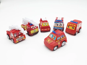 Detail view of 6-piece red cartoon fire truck toy set with expressive eyes and markings