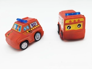 Detail view of two red mini inertia toy cars: a fire truck and an ambulance with 911 decals