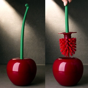 Creative cherry shaped toilet brush with red plastic bristles and green stem handle