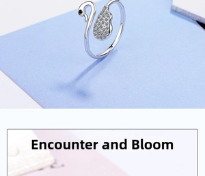 Detail of elegant swan ring with white cubic zirconia pavé and adjustable silver band