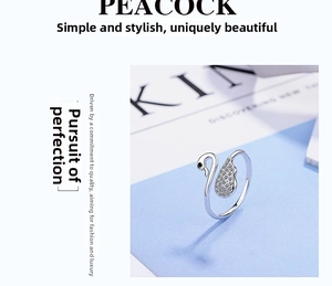 Detailed close-up of swan open ring featuring cubic zirconia stones and a silver finish