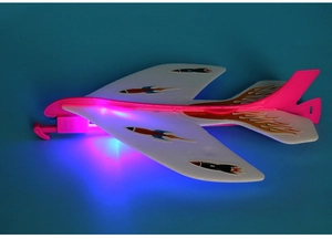 Detail showing the glowing blue LED lights on the foam slingshot glider toy with rocket stickers