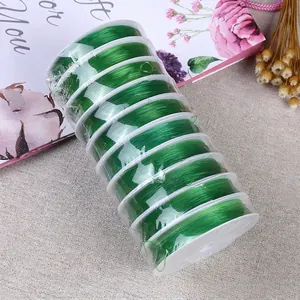 Macro shot of 10 spools of green elastic crystal cord for DIY jewelry making