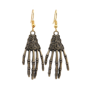 Gothic Halloween skeleton hand drop earrings in vintage bronze finish on white background
