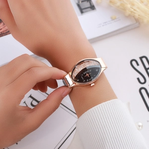 Close-up of elegant ladies' oval watch with rose gold case and sparkling dial detail